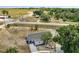 Aerial view of a single-story home with front yard and driveway at 7 Garvey Ln, Frostproof, FL 33843