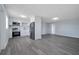 Modern kitchen featuring stainless appliances, white cabinets, and gray flooring at 7 Garvey Ln, Frostproof, FL 33843