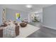 Inviting living room featuring stylish furniture, modern decor, and plenty of natural light at 7 Garvey Ln, Frostproof, FL 33843