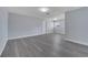 Open living space features gray floors and neutral-colored walls at 7 Garvey Ln, Frostproof, FL 33843