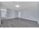Open living room featuring gray floors, neutral walls, and recessed lighting at 7 Garvey Ln, Frostproof, FL 33843