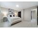 Comfortable bedroom with a neutral color scheme, stylish side tables, and a serene atmosphere at 741 Orange Ave, Longwood, FL 32750