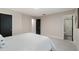 Bedroom featuring access to an ensuite bathroom, a neutral color scheme, and modern fixtures at 741 Orange Ave, Longwood, FL 32750