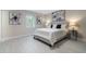 Bright bedroom featuring neutral decor, plush carpeting, and natural light from a large window at 741 Orange Ave, Longwood, FL 32750