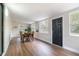 Bright dining area with hardwood floors, natural lighting, and stylish furniture perfect for Gathering gatherings at 741 Orange Ave, Longwood, FL 32750