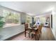 Bright dining area with hardwood floors, natural lighting, and stylish furniture perfect for Gathering gatherings at 741 Orange Ave, Longwood, FL 32750
