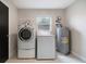 Laundry room equipped with washer, dryer, and window offering practical convenience at 741 Orange Ave, Longwood, FL 32750