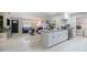 Open-concept living room featuring modern furnishings and a kitchen island with marble countertops at 741 Orange Ave, Longwood, FL 32750