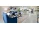 Open-concept living area with stylish furnishings, modern decor, and seamless flow into the adjacent kitchen space at 741 Orange Ave, Longwood, FL 32750