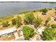 Aerial view of a home near a lake featuring mature trees at 75 Garrison Ln, Frostproof, FL 33843