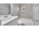 Bathroom with neutral tile, shower and tub, and white vanity at 75 Garrison Ln, Frostproof, FL 33843