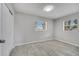 Bedroom with tile flooring, neutral walls, light, bright ceiling and windows at 75 Garrison Ln, Frostproof, FL 33843