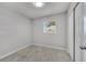 Bedroom with tile flooring, neutral walls, a light and bright ceiling, and closet with double doors at 75 Garrison Ln, Frostproof, FL 33843