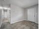 Hallway with tile flooring leads to adjacent rooms with neutral paint at 75 Garrison Ln, Frostproof, FL 33843