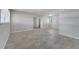 Spacious living area with large windows and tile flooring, ready for personalization at 75 Garrison Ln, Frostproof, FL 33843