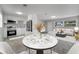 Bright living space featuring a modern kitchen, dining area and a comfortable sitting area with contemporary decor at 75 Garrison Ln, Frostproof, FL 33843