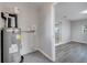 Utility room featuring a water heater and view into adjoining room at 75 Garrison Ln, Frostproof, FL 33843