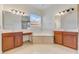 Bright bathroom features double sink vanity and a soaking tub at 902 Hire Cir, Ocoee, FL 34761