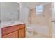 Bathroom featuring a vanity with a wood cabinet and shower-tub combo at 902 Hire Cir, Ocoee, FL 34761