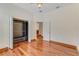 Bedroom with closet, hardwood floors, natural light, and view to other rooms at 902 Hire Cir, Ocoee, FL 34761