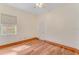 Bright bedroom features wood floors, a window, and a ceiling fan at 902 Hire Cir, Ocoee, FL 34761