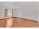 Spacious bedroom featuring hardwood floors, neutral walls, and window at 902 Hire Cir, Ocoee, FL 34761