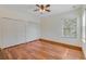 Comfortable bedroom with wood floors, neutral walls, and closet at 902 Hire Cir, Ocoee, FL 34761