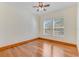Cozy bedroom with hardwood floors, ceiling fan, and plenty of natural light at 902 Hire Cir, Ocoee, FL 34761