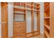 Spacious walk-in closet with custom shelving and drawers for optimal organization at 902 Hire Cir, Ocoee, FL 34761
