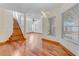 Open-concept dining area with hardwood floors and views of the staircase at 902 Hire Cir, Ocoee, FL 34761