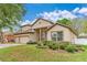 Charming two-story home with a three-car garage and well-manicured landscaping at 902 Hire Cir, Ocoee, FL 34761