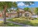 Charming two-story home with a three-car garage and well-manicured landscaping at 902 Hire Cir, Ocoee, FL 34761