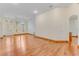 Inviting living room showcasing hardwood floors, ample natural light, and neutral wall color at 902 Hire Cir, Ocoee, FL 34761