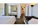 Bedroom featuring two beds, mirrored closet, and attached bath at 921 Begonia Rd # 302, Celebration, FL 34747