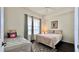 Bright bedroom with two beds, natural light, and modern decor at 921 Begonia Rd # 302, Celebration, FL 34747