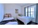 Bright bedroom featuring two twin beds, large windows and neutral decor at 921 Begonia Rd # 302, Celebration, FL 34747