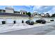 Individual garages with parking in the front of a low-rise community near landscaped common areas at 921 Begonia Rd # 302, Celebration, FL 34747