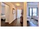 Hallway with wood flooring, views of bedrooms, and decorative furnishings at 921 Begonia Rd # 302, Celebration, FL 34747