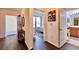 Hallway showcasing wood floors, a bedroom, and a partial bathroom view at 921 Begonia Rd # 302, Celebration, FL 34747