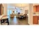 A spacious living room featuring hardwood floors, comfortable seating, and dining area at 921 Begonia Rd # 302, Celebration, FL 34747