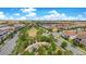 An aerial view of a suburban neighborhood with a playground, green space, and sidewalks in a Gathering-friendly community at 9544 Mere Pkwy, Orlando, FL 32832