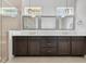 Elegant bathroom featuring double sinks, granite countertops, and a glass-enclosed shower at 9544 Mere Pkwy, Orlando, FL 32832
