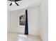 Clean bedroom featuring a single window and dark blue curtains at 9544 Mere Pkwy, Orlando, FL 32832