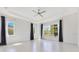 Bright and airy bedroom with large windows, tray ceilings, and tile floors offers a serene retreat at 9544 Mere Pkwy, Orlando, FL 32832