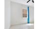 This bedroom has a window providing natural light and neutral walls for a calming space at 9544 Mere Pkwy, Orlando, FL 32832