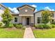 Charming single-Gathering home featuring a well-manicured lawn and inviting entrance at 9544 Mere Pkwy, Orlando, FL 32832