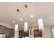 Contemporary pendant lighting over the kitchen island, adding a modern touch to the space at 9544 Mere Pkwy, Orlando, FL 32832