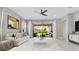 Bright living room featuring a large sliding glass door to the lanai at 9544 Mere Pkwy, Orlando, FL 32832