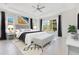 Spacious main bedroom with tray ceiling, large windows, and a cozy seating area at 9544 Mere Pkwy, Orlando, FL 32832