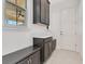 This mudroom features built-in cabinets and bench seating for seamless organization at 9544 Mere Pkwy, Orlando, FL 32832